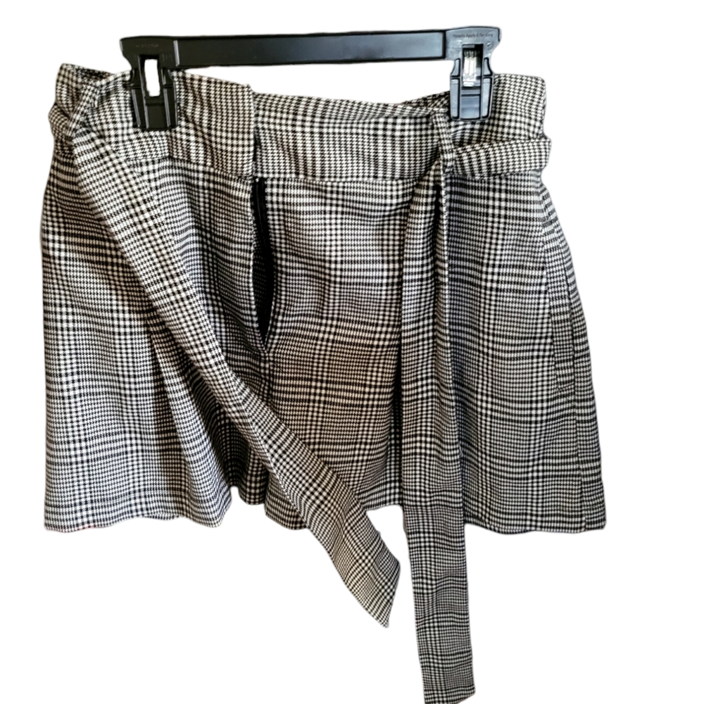 Black and white checkered shorts with bow tie belt